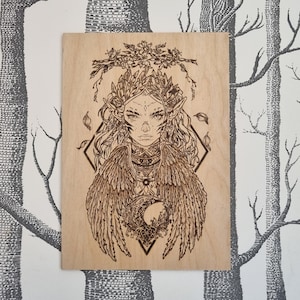 The Raven Queen wood burned art piece.