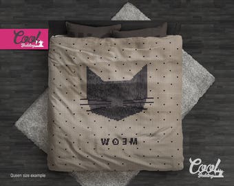 May include: A queen-sized bedding set with a beige background and a black cat design. The cat is pixelated and the text "Meow" is written below it. The bedding set is made by Cool Bedding.
