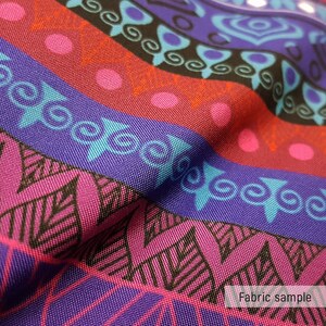 May include: Close-up of a colorful fabric with a geometric pattern. The fabric is a mix of purple, pink, blue, and black. The pattern is made up of stripes, circles, and swirls. The fabric is textured and has a slight sheen. "Fabric sample" is printed at the bottom of the image.