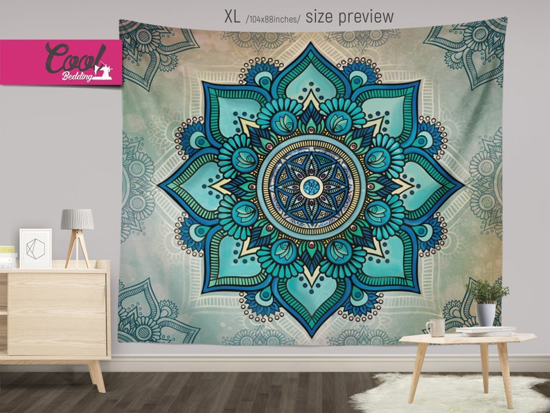 May include: A blue and green mandala tapestry with intricate details. The mandala is surrounded by a white border and a light blue background.