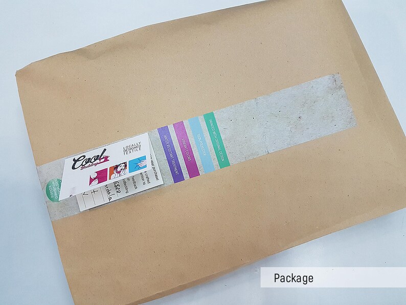 May include: A brown paper package with a white label that says "Cool Designs" and a sticker with a colorful design. The package is sealed with a strip of tape.