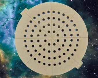 May include: A beige round pizza cutter with a circular handle and a series of small holes in a radial pattern. The cutter is designed to cut pizza dough.