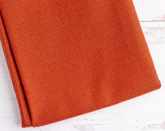 Tela de algodón con estampado geométrico en naranja y marrón - Buggy Barn Basics