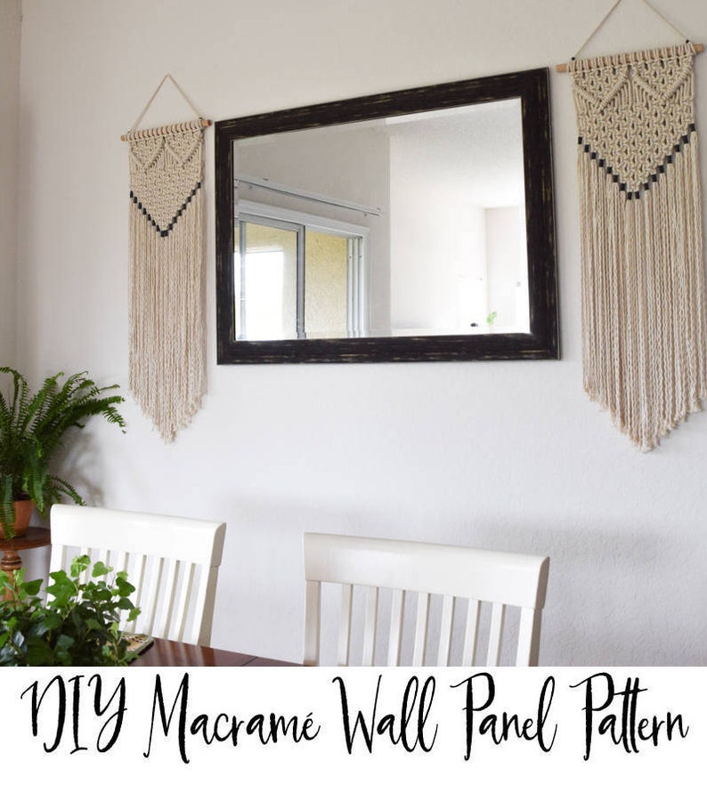 May include: Two macrame wall hangings with a black and white geometric pattern, hanging on a white wall with a black framed mirror in between them. The text "DIY Macrame Wall Panel Pattern" is at the bottom of the image.