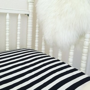 Lined black and white crib sheet