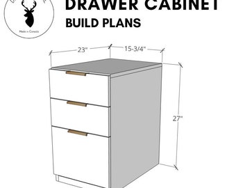 May include: A white drawer cabinet with three drawers and wooden pulls. The cabinet is 23 inches wide, 15-3/4 inches deep, and 27 inches tall. The text "DRAWER CABINET BUILD PLANS" is at the top of the image. The text "Downloadable PDF" is at the bottom of the image.