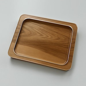 May include: A rectangular wooden tray with a silver rim. The tray has a natural wood grain pattern.