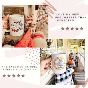 May include: Two white ceramic mugs with autumn-themed designs. The first mug features a red truck and the text "It's the most wonderful time of the year". The second mug features a wreath of fall leaves and the text "Fall breeze, autumn leaves, pumpkin spice please".