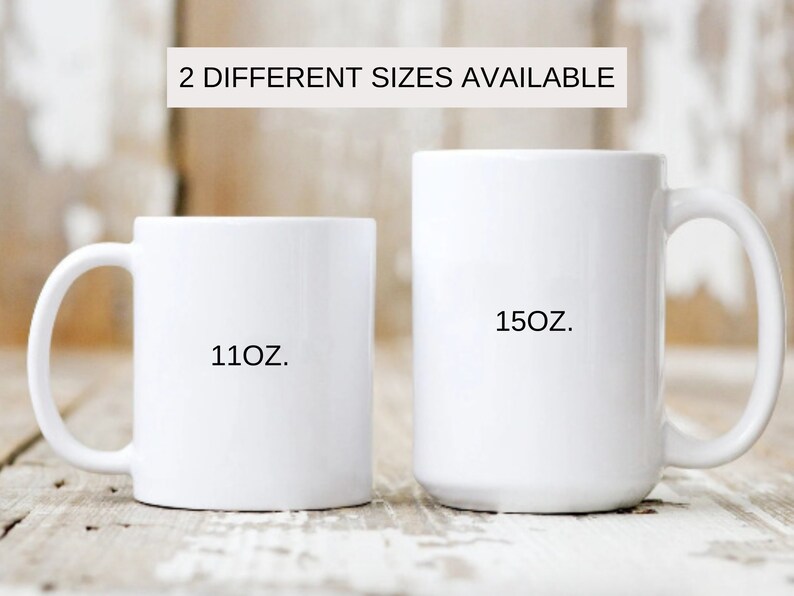 May include: Two white ceramic mugs with black text. The smaller mug says "11oz." and the larger mug says "15oz."