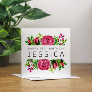 May include: A white card with a pink floral design and the text "Happy 18th Birthday Jessica".