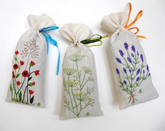 Scented lavender bags in hand-embroidered linen with poppies, dill and lavender stem