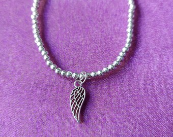 Angel Wing Charm Bracelet | Beaded Elastic Jewellery | Spiritual & Statement Accessory