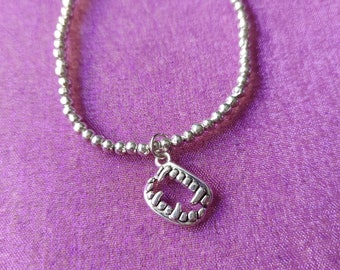 Beaded Vampire Fangs Charm Bracelet | Silver Plated Pendant on Elastic | Halloween & Gothic Jewelry