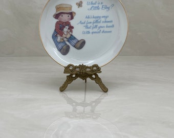 What is a Little Boy Decorative Plate on Brass Easel