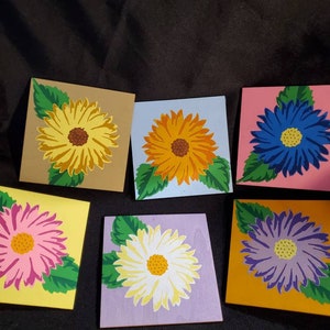 Flower tiles signs,  sunflower painted in 6 different color schemes.