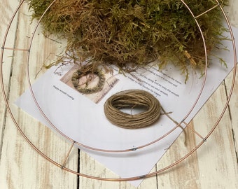 DIY wreath making. Wreath wire frame, moss and string. Get creative and make your own Christmas door wreath. DIY wreath kit.