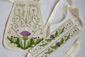 The set of embroidered Scottish stocking garters and of Georgian pocket of 18th century with thistles.