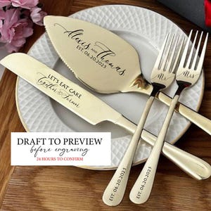 May include: A gold-toned wedding cake serving set with a cake knife, server, and two forks. The server and knife are engraved with names and a date. The forks are marked "Mr" and "Mrs". The set is displayed on a white plate.