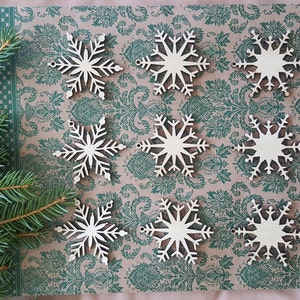 Decorazioni natalizie a forma di fiocco di neve in legno tagliato al laser, set da 9