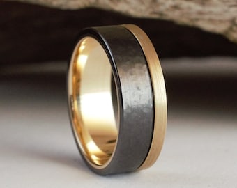 Gold ring with a black hamered finish. Male wedding band