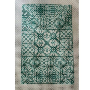 May include: A green and white cross-stitch pattern with a geometric design. The pattern is made up of squares, rectangles, and stars.