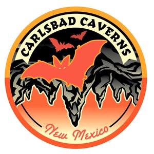 May include: A round orange and yellow sticker with the text "Carlsbad Caverns New Mexico" and a silhouette of bats flying over a cave entrance.