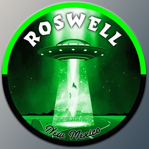May include: A green circle with a white outline and the text "ROSWELL New Mexico" in white. A black UFO with white lights is flying over a road with a beam of light shining down from the UFO.