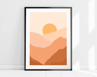 Puede incluir: Lámina artística enmarcada que presenta un paisaje abstracto con una paleta de colores cálidos. La obra de arte representa una puesta de sol estilizada sobre formas montañosas en capas en tonos naranja, melocotón y marrón. La impresión está enmarcada en un marco negro.