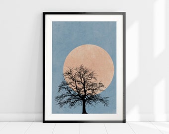 May include: A framed print of a minimalist illustration of a tree with a large, pale orange moon behind it. The background is a light blue color.