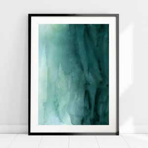 Könnte beinhalten: Abstrakte Aquarellmalerei in Blaugrüntönen und Grün, gerahmt in einem schwarzen Rahmen.