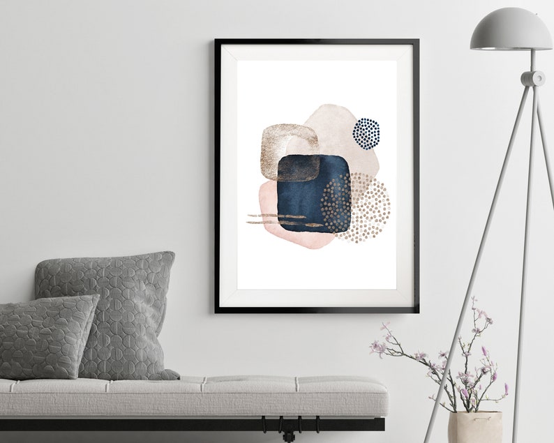 May include: Abstract art print featuring a composition of overlapping shapes in shades of pink, blue, and gold. The shapes are outlined in black and have a watercolor effect. The print is perfect for adding a touch of modern art to any room.