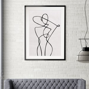K&ouml;nnte beinhalten: Schwarz-wei&szlig;-Linienkunst-Druck einer stilisierten Figur in einem schwarzen Rahmen. Der Druck ist auf wei&szlig;em Hintergrund.