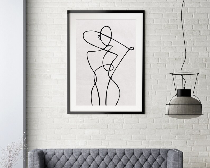 K&ouml;nnte beinhalten: Schwarz-wei&szlig;-Linienkunst-Druck einer stilisierten Figur in einem schwarzen Rahmen. Der Druck ist auf wei&szlig;em Hintergrund.