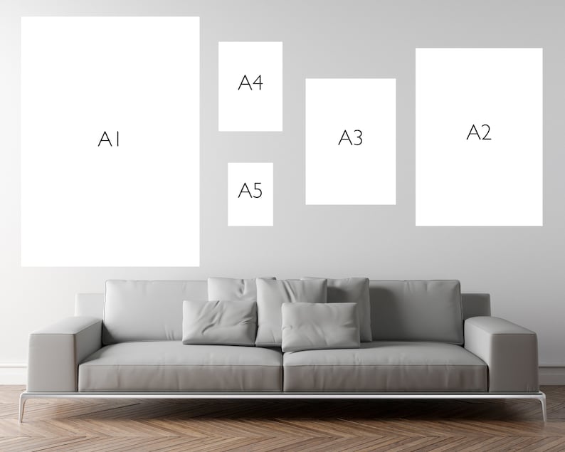 May include: A white wall with five different sized white frames. The frames are labeled A1, A2, A3, A4, and A5. A gray couch is in front of the wall.