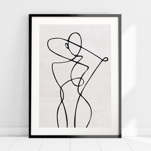 K&ouml;nnte beinhalten: Eine Schwarz-Wei&szlig;-Linienzeichnung eines menschlichen Torsos im minimalistischen Stil. Die Zeichnung ist in einem schwarzen Rahmen gerahmt und befindet sich auf einem wei&szlig;en Hintergrund.