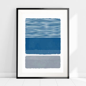 May include: Abstract art print with a blue and gray color scheme. The print features a series of horizontal stripes in blue and white, followed by a solid blue rectangle and a gray rectangle.