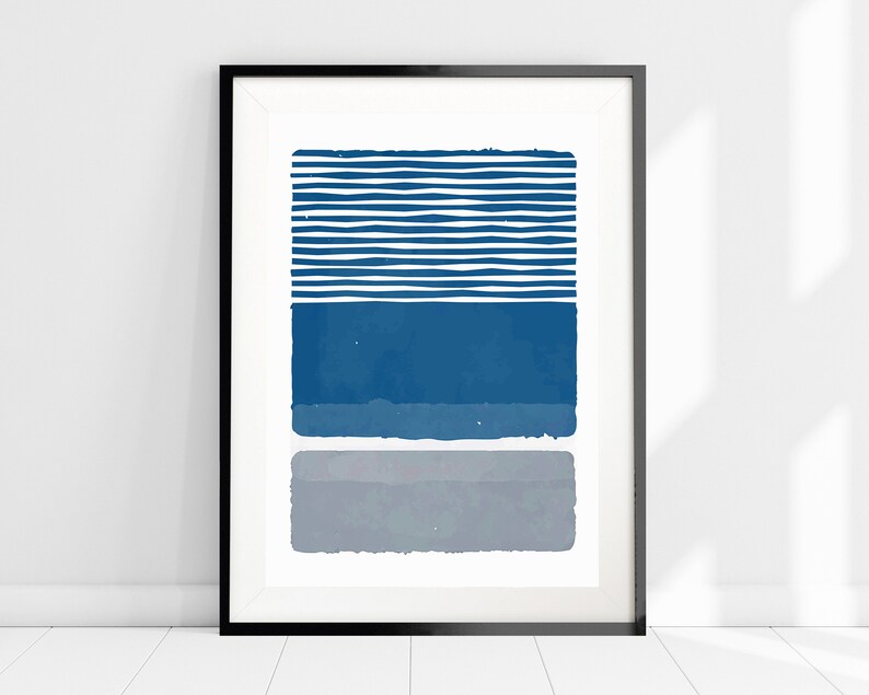 May include: Abstract art print with a blue and gray color scheme. The print features a series of horizontal stripes in blue and white, followed by a solid blue rectangle and a gray rectangle.