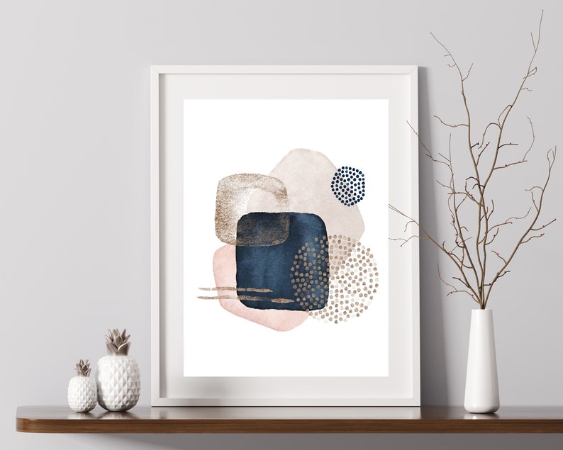 May include: Abstract art print featuring a white background with overlapping shapes in shades of pink, blue, and gold. The shapes are textured with small dots and lines.
