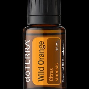 May include: A 15 mL amber glass bottle of dōTERRA Wild Orange essential oil supplement with a black cap. The label features the text dōTERRA, Wild Orange, Citrus sinensis, and Essential Oil Supplement printed in white and black on an orange background.
