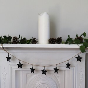 These black metal stars are perfect for a garland hanging from a mantle piece.  See our other listing, or order extra stars on this listing.