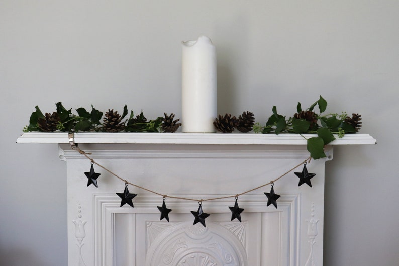 These black metal stars are perfect for a garland hanging from a mantle piece.  See our other listing, or order extra stars on this listing.