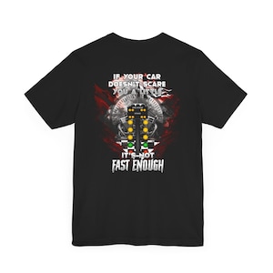 May include: Black t-shirt with a graphic of a drag racing Christmas tree and the text "If your car doesn't scare you a little it's not fast enough."