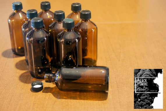 Laboratory pharmacy bottles in amber vintage brown glass medicine bottles