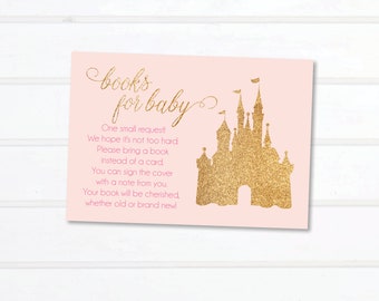 Puede incluir: Tarjeta de invitación de baby shower rosa y dorada con una silueta de castillo de purpurina dorada y el texto "books for baby". La tarjeta también incluye el texto "One small request! We hope it's not too hard. Please bring a book instead of a card. You can sign the cover with a note from you. Your book will be cherished, whether old or brand new!" y el texto "tea olive design shop".