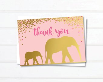 May include: Pink thank you card with gold glitter and two gold elephant silhouettes. The text "thank you" is in pink.