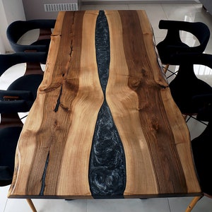 Live Edge Dining Graphite River Table made in a modern rustic finish with black steel legs and Graphite Grey epoxy resin river