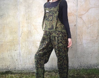 May include: Black and green patterned overalls with adjustable straps. The overalls have a wide leg and are made of a soft, comfortable fabric.