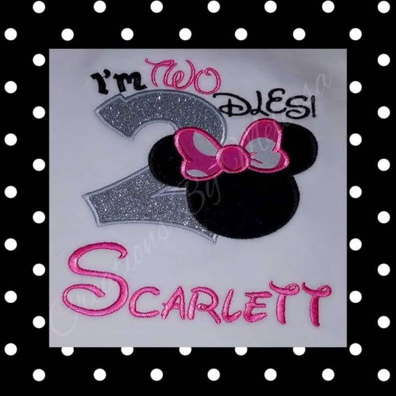 May include: A white t-shirt with a silver glitter number two, the words "I'm Two Disney", a black and white Minnie Mouse head with a pink bow, and the name "Scarlett" in pink.