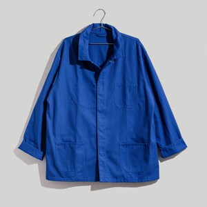 May include: A blue work jacket with long sleeves, a button-up front, and multiple pockets.