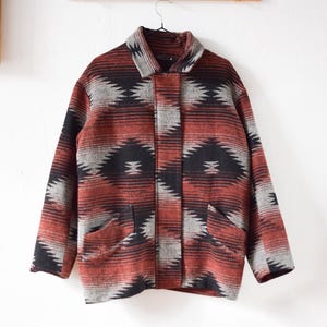 May include: A rustic wooden sign with the text "Welcome to our home" in white lettering. The sign features a distressed finish and a simple, inviting design, perfect for entryway decor.